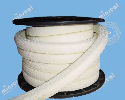 A spool of thick white braided rope against a blue background.