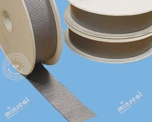 Spools of metallic flat wire ribbon against a blue background.