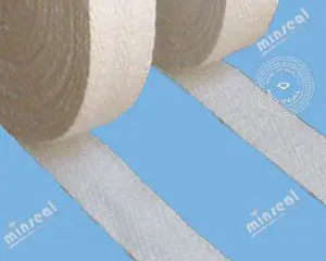 Rolls of white fabric tape unrolling across a blue background.