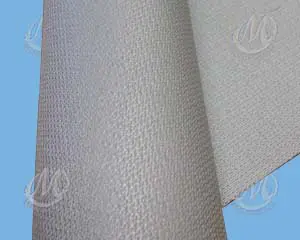 Close-up of a textured, light gray fabric sheet with a subtle pattern, set against a blue background.
