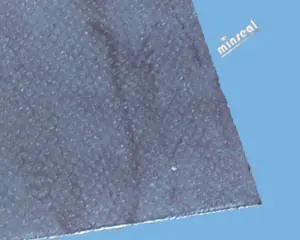 Textured dark surface with blue background.
