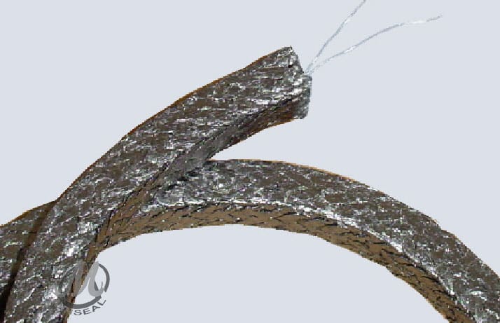 Metallic braided sealing gasket with fibers exposed.