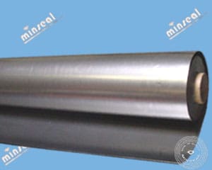 graphitefoil Roll of metal sheet on blue background.
