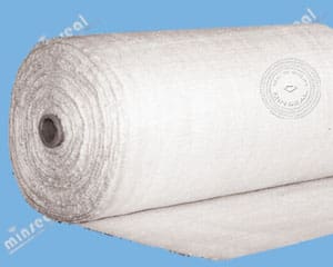 Roll of white fabric on blue background.