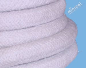 Ceramic Fiber Round Braided Rope Coiled white rope on blue background.