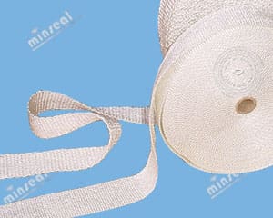 3320G-FiberglassTape White rolled tape on blue background.